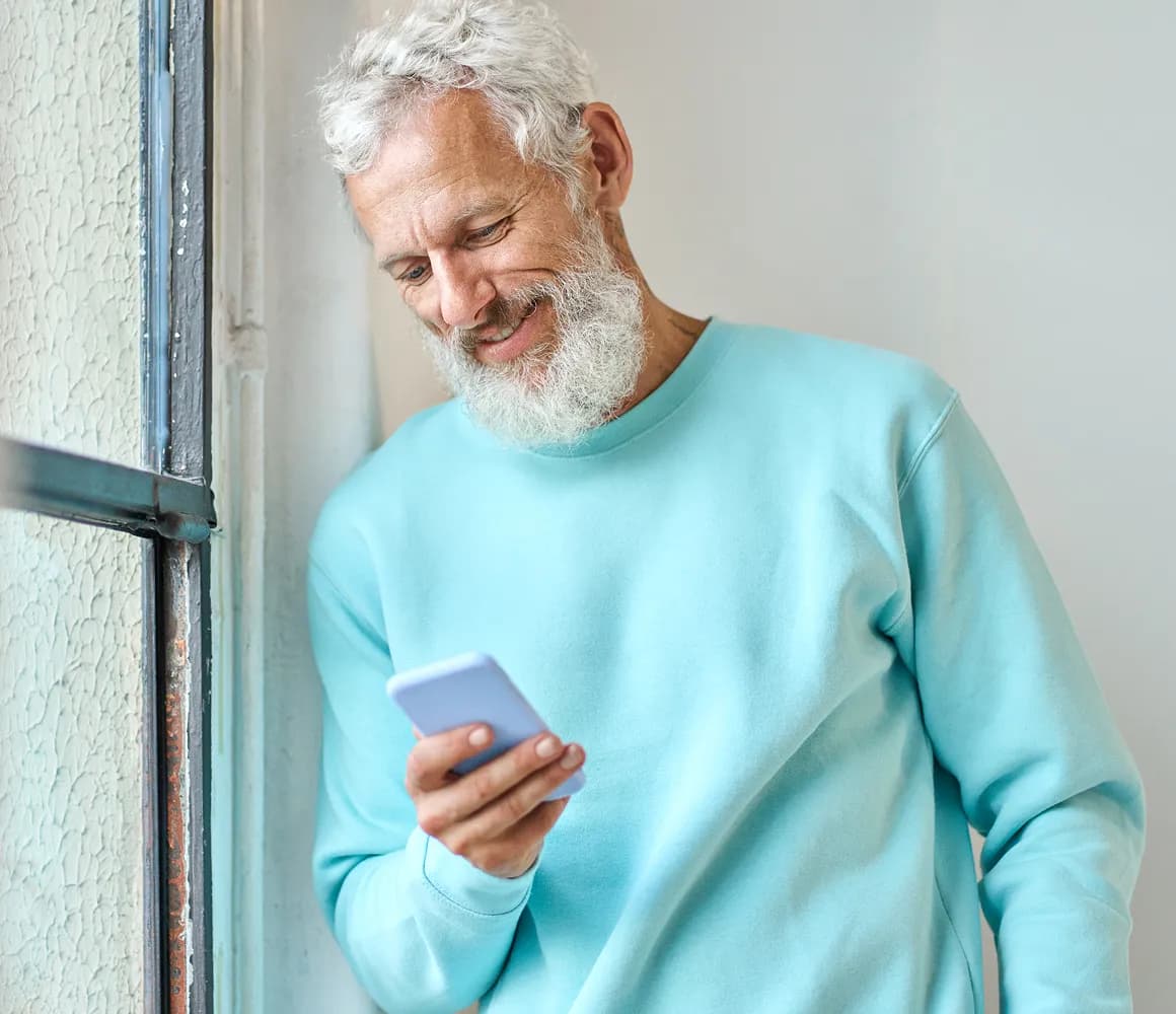 A property investor reviewing information on a phone